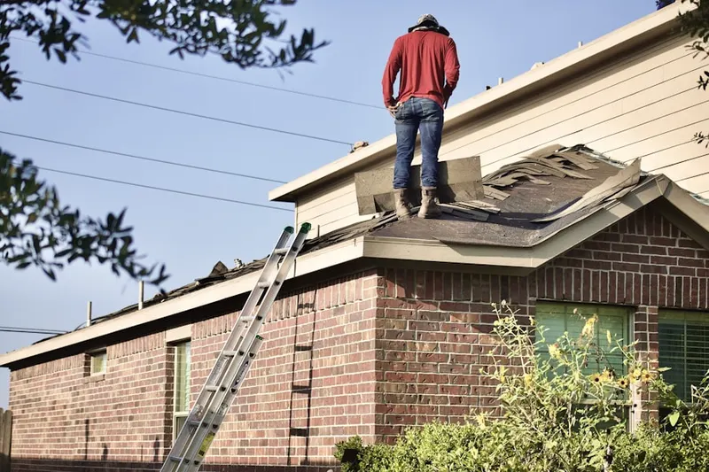 Professional roofer working on a residential roof in Lago Vista
